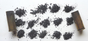 Several small piles of black powder